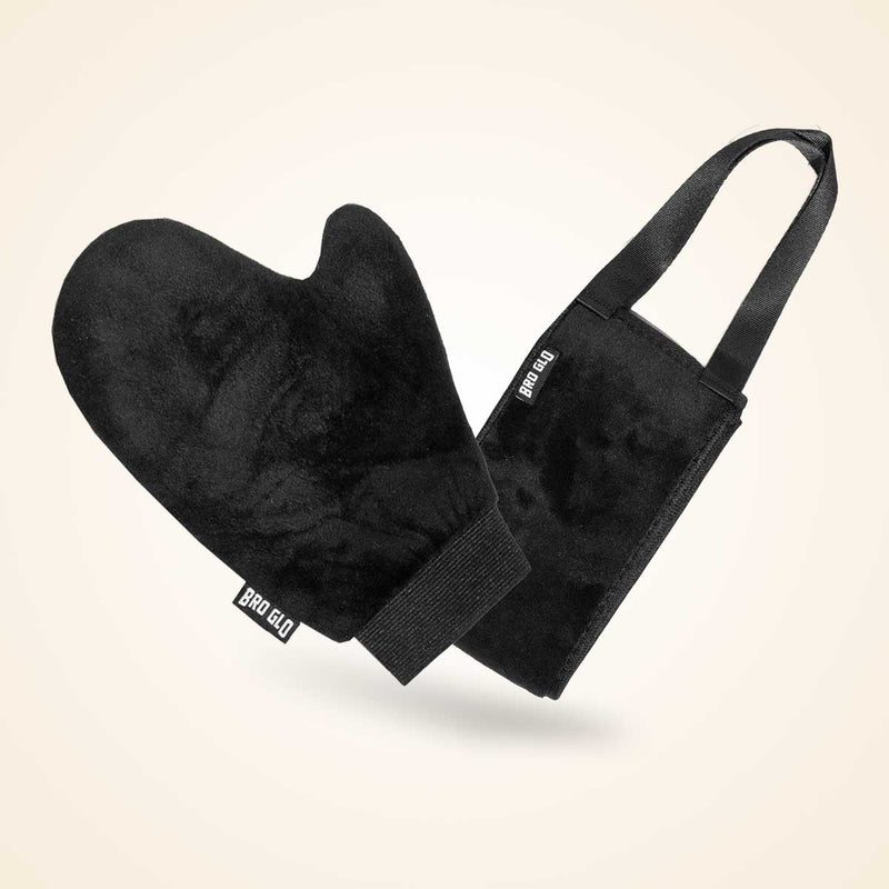 Black velvet applicator mitt with attached carrying pouch and shoulder strap on cream background.