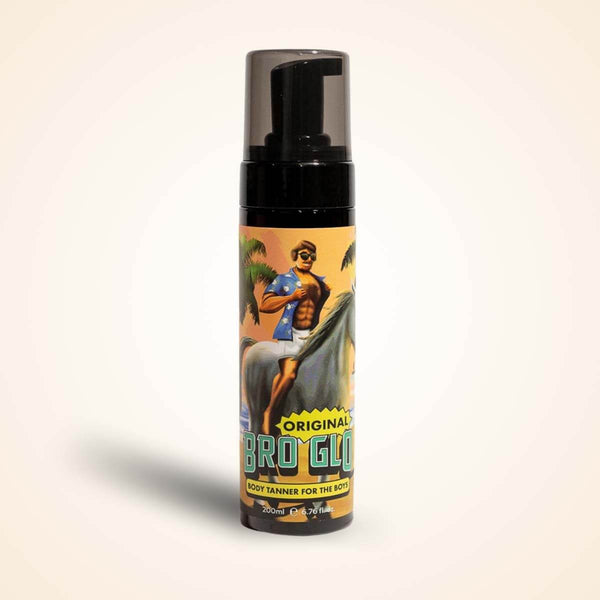 A spray bottle with a black pump top displays vintage-style artwork of a shirtless man on a golden background.