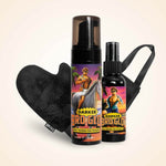 Two spray tan bottles with retro illustrations displayed next to a black heart-shaped applicator mitt.